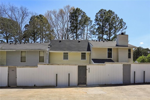 4322 Idlewood Ln, Tucker, GA 30084 - exterior space featuring a chimney and a shingled roof