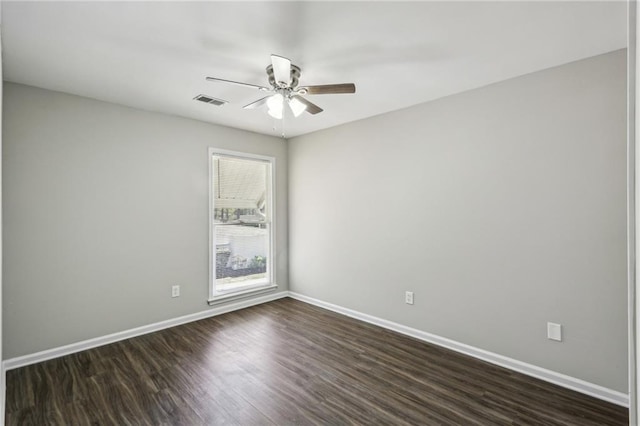 4322 Idlewood Ln, Tucker, GA 30084 - unfurnished room with baseboards, dark wood-style floors, visible vents, and a ceiling fan