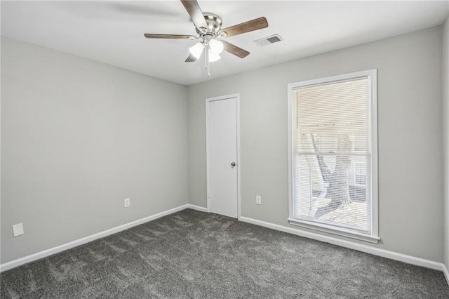 4322 Idlewood Ln, Tucker, GA 30084 - spare room featuring baseboards, dark colored carpet, ceiling fan, and visible vents