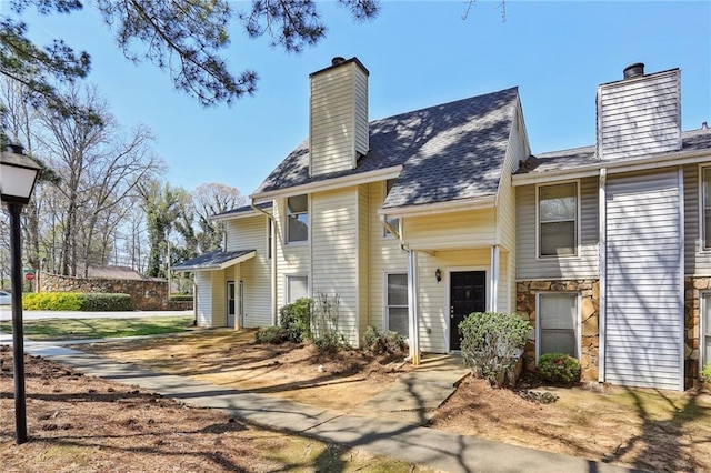 4322 Idlewood Ln, Tucker, GA 30084 - view of front facade with stone siding and a chimney