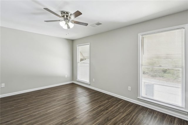 4322 Idlewood Ln, Tucker, GA 30084 - unfurnished room featuring dark wood-type flooring, baseboards, ceiling fan, and visible vents