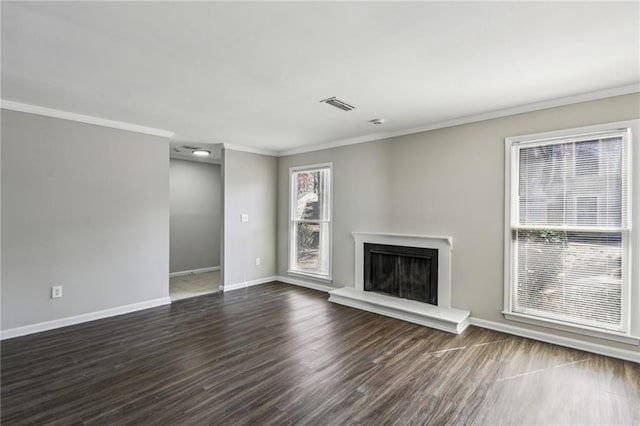 4322 Idlewood Ln, Tucker, GA 30084 - unfurnished living room with dark wood-style flooring, visible vents, baseboards, a fireplace with raised hearth, and ornamental molding