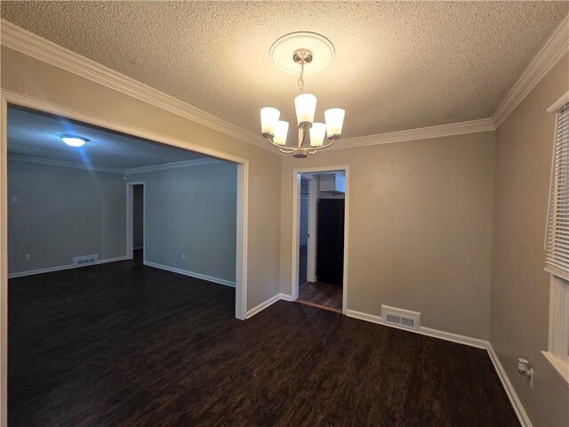 empty room featuring crown molding, dark wood-type flooring, a textured ceiling, and a notable chandelier