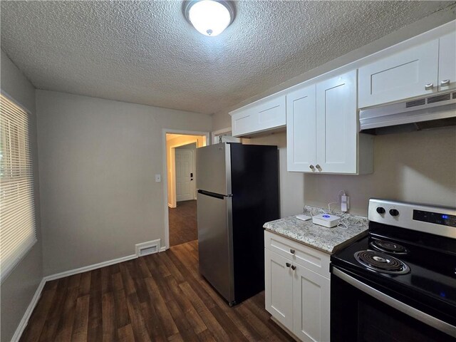 kitchen with white cabinets, stainless steel appliances, and dark wood-type flooring