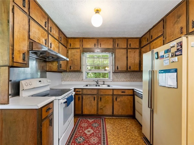 784 San Miguel Dr, Stone Mountain, GA 30083 - kitchen featuring white appliances, under cabinet range hood, brown cabinets, a textured ceiling, and light countertops