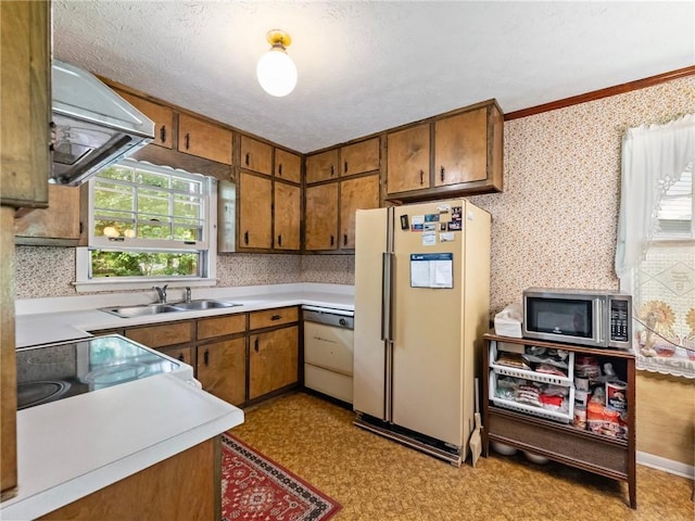 784 San Miguel Dr, Stone Mountain, GA 30083 - kitchen featuring freestanding refrigerator, stainless steel microwave, dishwashing machine, extractor fan, and brown cabinets