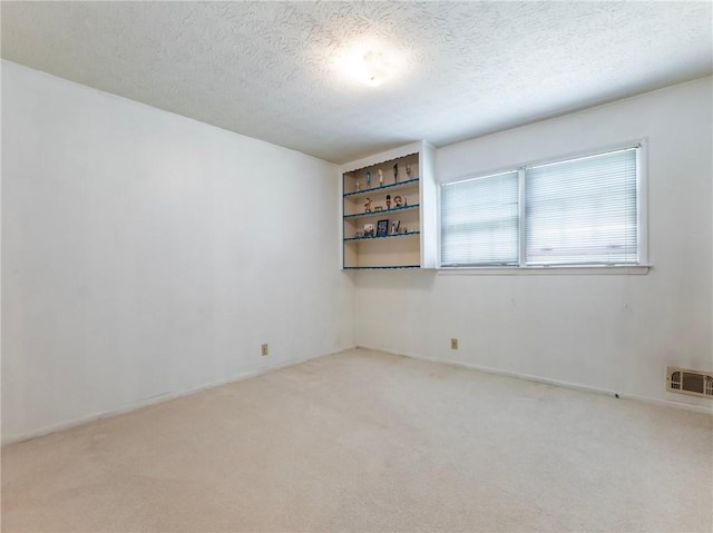 784 San Miguel Dr, Stone Mountain, GA 30083 - carpeted empty room with a textured ceiling