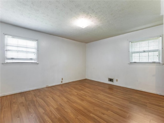 784 San Miguel Dr, Stone Mountain, GA 30083 - empty room featuring wood finished floors and a textured ceiling