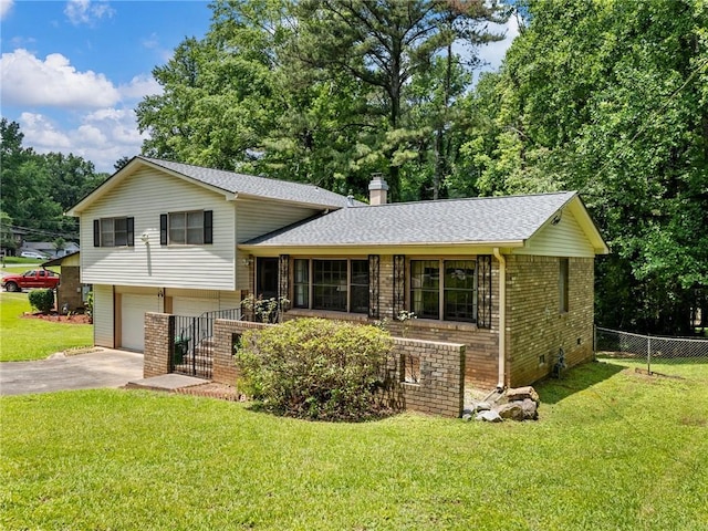 784 San Miguel Dr, Stone Mountain, GA 30083 - tri-level home with brick siding, a garage, asphalt driveway, roof with shingles, and a chimney