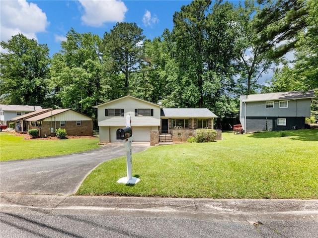 784 San Miguel Dr, Stone Mountain, GA 30083 - tri-level home with an attached garage, asphalt driveway, a front lawn, a porch, and brick siding