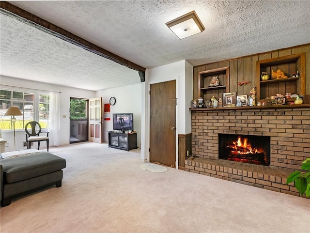 784 San Miguel Dr, Stone Mountain, GA 30083 - living area featuring light colored carpet, a textured ceiling, a brick fireplace, and wood walls
