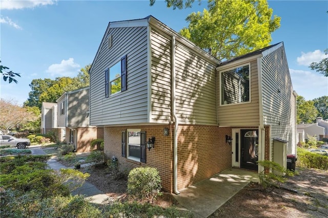 view of front of house with brick siding