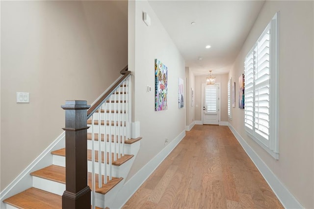 920 Wemberley Ln, Marietta, GA 30064 - hallway with wood finished floors, a chandelier, stairway, recessed lighting, and baseboards