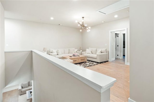 920 Wemberley Ln, Marietta, GA 30064 - living room with light wood-style flooring, a chandelier, recessed lighting, attic access, and baseboards