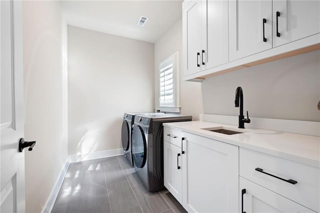 920 Wemberley Ln, Marietta, GA 30064 - washroom with washing machine and clothes dryer, cabinet space, and baseboards