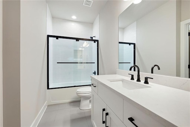 920 Wemberley Ln, Marietta, GA 30064 - full bathroom with vanity, toilet, combined bath / shower with glass door, tile patterned floors, and baseboards