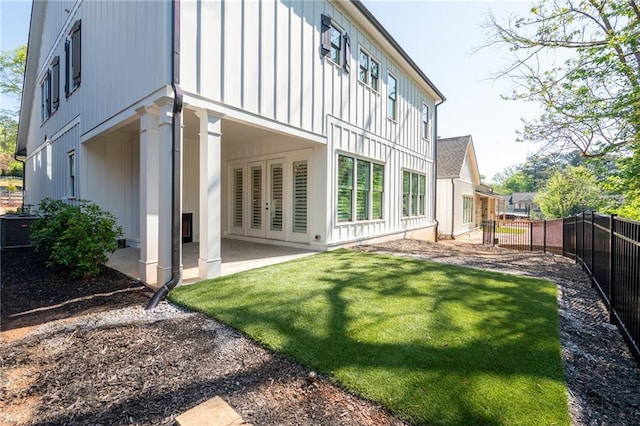 920 Wemberley Ln, Marietta, GA 30064 - back of property with board and batten siding, a patio area, and central air condition unit