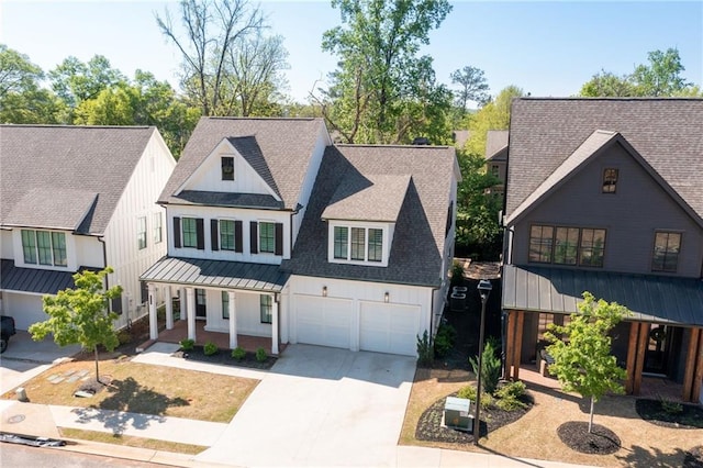 920 Wemberley Ln, Marietta, GA 30064 - modern inspired farmhouse featuring a porch, a standing seam roof, driveway, a shingled roof, and board and batten siding