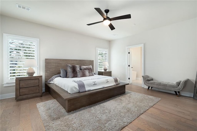 920 Wemberley Ln, Marietta, GA 30064 - bedroom featuring wood finished floors, baseboards, a ceiling fan, and connected bathroom