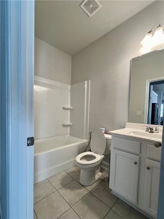 full bathroom featuring vanity, tile patterned floors, shower / bathtub combination, and toilet