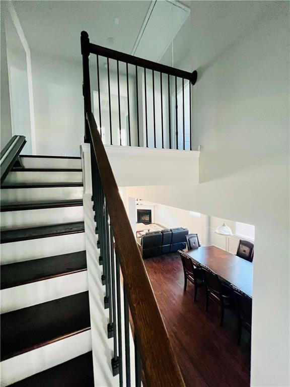 stairway with hardwood / wood-style flooring