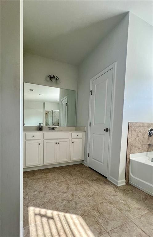 bathroom featuring vanity and a bathtub