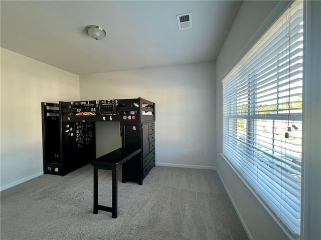 game room with light colored carpet