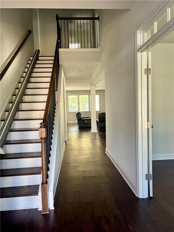 stairway featuring wood-type flooring