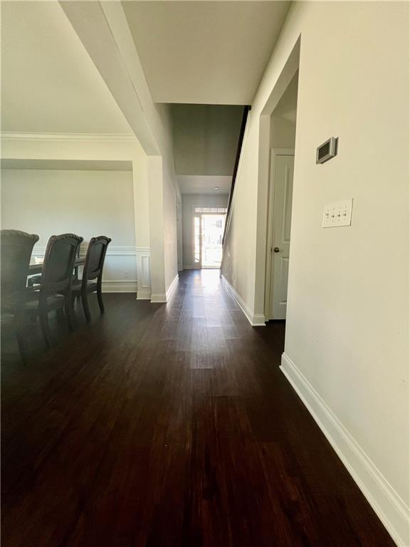 corridor featuring dark hardwood / wood-style floors