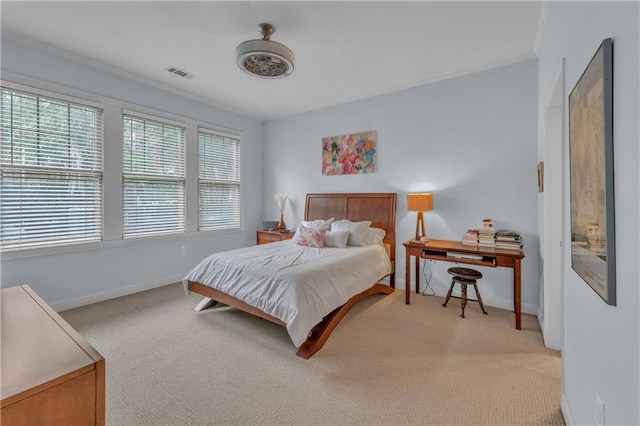 bedroom with light colored carpet