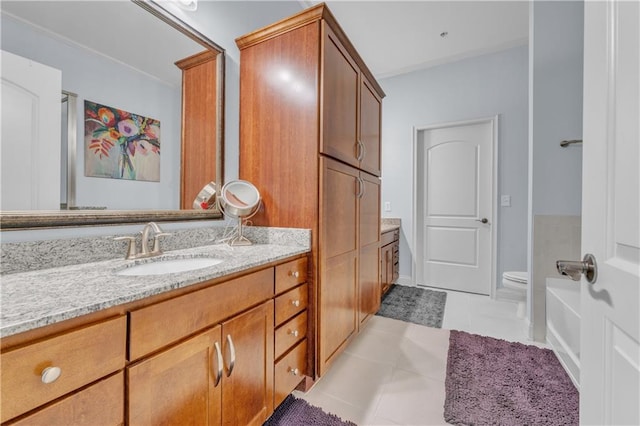 bathroom with tile patterned flooring, vanity, and toilet