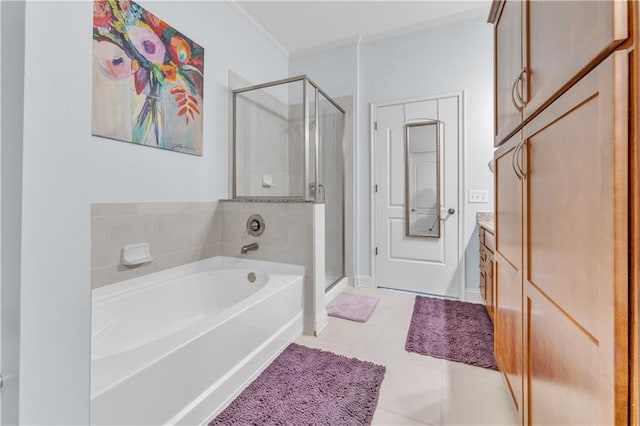 3621 Vinings Slope SE Unit 3202, Atlanta, GA 30339 - bathroom featuring tile patterned flooring, a shower stall, ornamental molding, vanity, and a garden tub