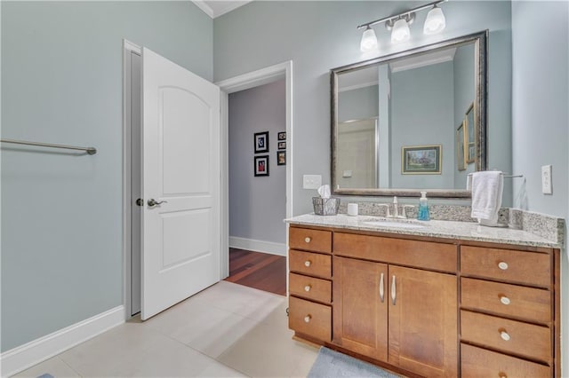 3621 Vinings Slope SE Unit 3202, Atlanta, GA 30339 - bathroom featuring ornamental molding, vanity, tile patterned floors, and baseboards