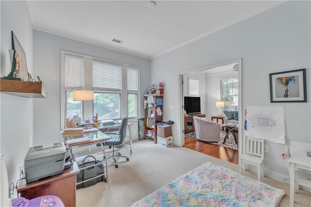 home office featuring light colored carpet and crown molding