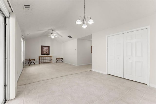 2428 Buena Vista Cir, Gainesville, GA 30504 - unfurnished living room featuring a chandelier, lofted ceiling, ceiling fan, baseboards, and light carpet