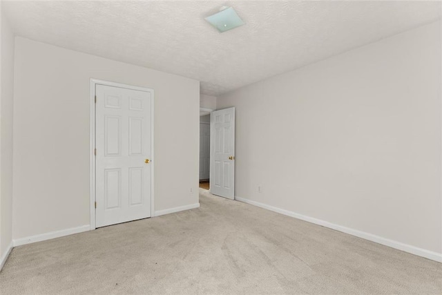 2428 Buena Vista Cir, Gainesville, GA 30504 - unfurnished bedroom with light carpet, baseboards, and a textured ceiling