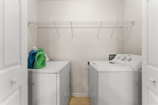2428 Buena Vista Cir, Gainesville, GA 30504 - laundry area with washer and clothes dryer and light tile patterned floors