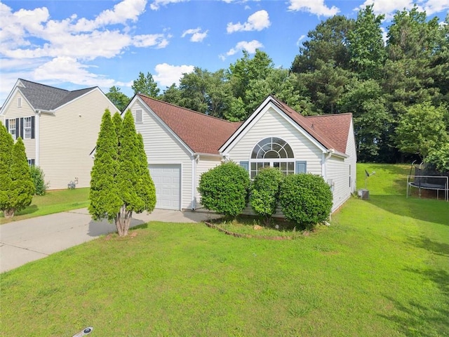 2428 Buena Vista Cir, Gainesville, GA 30504 - view of front of house featuring a trampoline, driveway, an attached garage, a front yard, and central AC unit