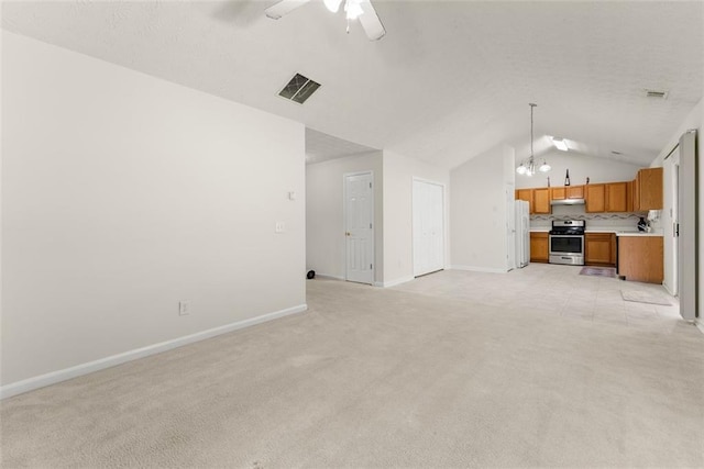 2428 Buena Vista Cir, Gainesville, GA 30504 - unfurnished living room featuring light colored carpet, vaulted ceiling, a chandelier, ceiling fan, and baseboards