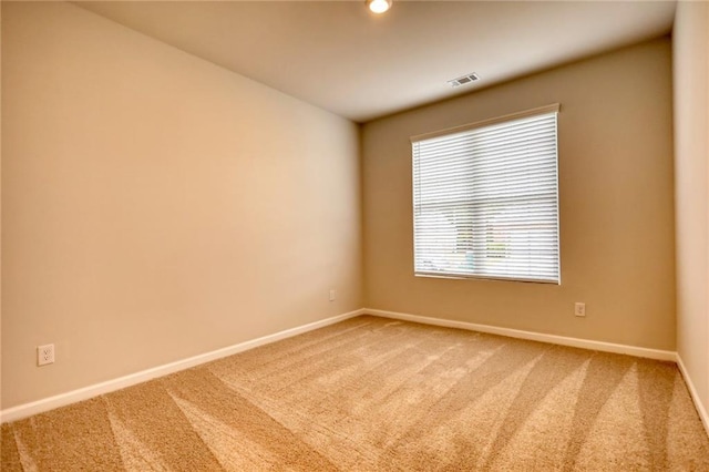 empty room featuring carpet floors