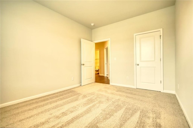 unfurnished bedroom with carpet flooring