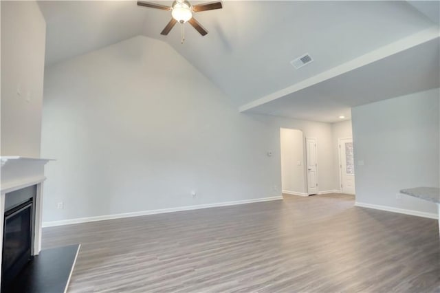 unfurnished living room with hardwood / wood-style flooring, ceiling fan, and lofted ceiling