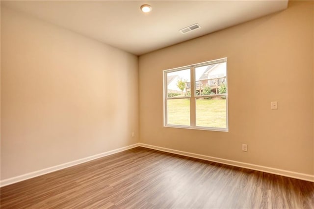 empty room featuring wood-type flooring