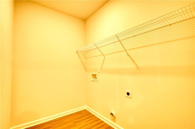 washroom featuring washer hookup, wood-type flooring, and hookup for an electric dryer