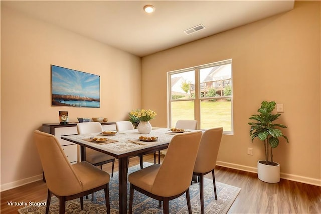 dining space featuring dark hardwood / wood-style flooring