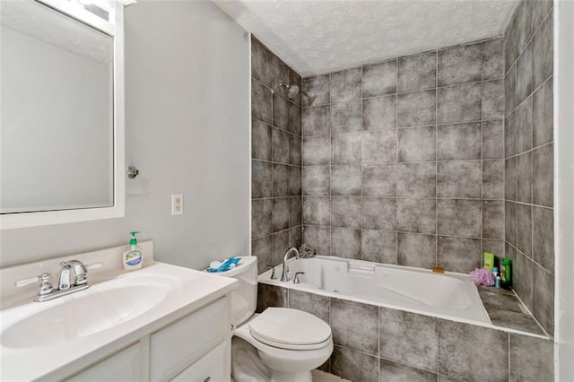 full bathroom featuring tiled shower / bath combo, vanity, a textured ceiling, and toilet