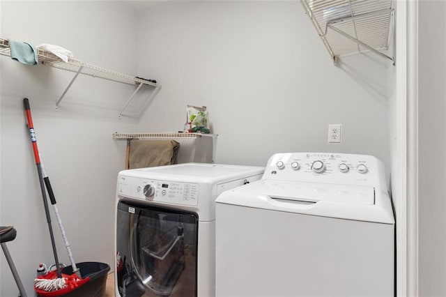 laundry room featuring separate washer and dryer