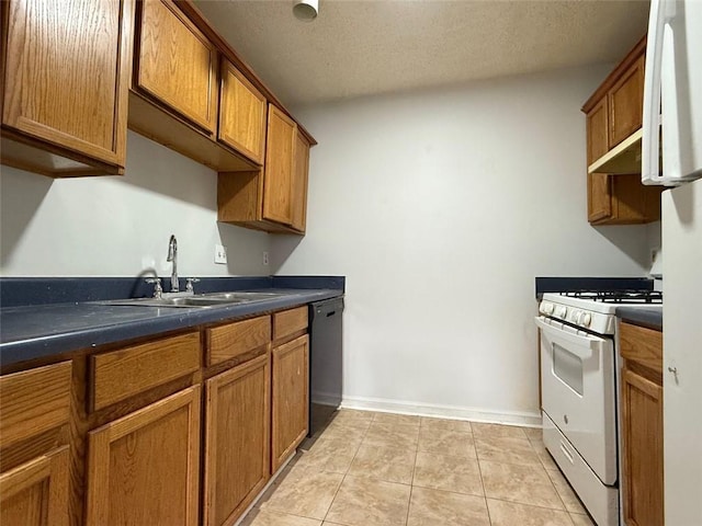 kitchen with white gas range, a textured ceiling, sink, black dishwasher, and light tile patterned flooring