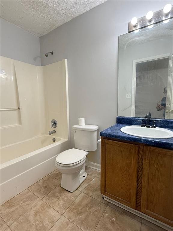 full bathroom with vanity, tile patterned flooring, toilet, a textured ceiling, and tub / shower combination