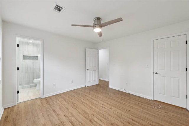 unfurnished bedroom featuring visible vents, a ceiling fan, connected bathroom, light wood-type flooring, and baseboards